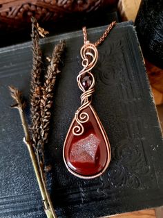 These pendants are handmade by shaping pure copper wire around a natural gemstone. Each piece is completely unique, only one available of each style. I do accept custom orders if you have a stone or design in mind. Pendants are sent with a 60cm flat link chain, made from copper plated steel. If you would like to upgrade your chain to 100% copper or in a different style, please have a look in my store.  Care Instructions The copper has been oxidised to prevent fast colour change and to highlight the detail in the pendants.  Copper will slowly tarnish over time, as with all metals. To maintain it's colour and shine, simply run the pendant under some warm water and rub gently with a very fine steel wool such as grade #0000 (available from most hardware stores). Alternatively you can use a jew Copper Wire Teardrop Pendant Jewelry Gift, Copper Wire Teardrop Pendant Jewelry For Gift, Nature-inspired Agate Jewelry For Gifts, Teardrop Copper Wire Jewelry For Gifts, Handmade Copper Wire Teardrop Pendant Jewelry, Brown Agate Jewelry For Gifts, Red Copper Jewelry Gift, Red Copper Jewelry For Gifts, Red Copper Jewelry For Gift