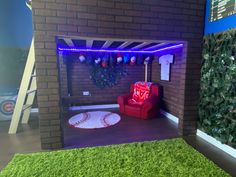 a living room with a couch and baseball rugs on the floor in front of a brick wall