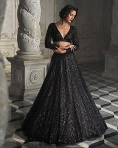 This lehenga set features black sequin embroidery on a dark nude base. It is paired with a full sleeves blouse and matching scalloped dupatta.From Seema Gujral's Inara collection. DELIVERY TIMEPlease allow 8-12 weeks for your outfit to arrive. FABRIC DETAILSNet Professional cleaning only. Seema Gujral Black Lehenga, Black Glitter Blouse Designs, Glitter Lehenga Designs, Black Glitter Lehenga, Lengha Blouse Designs Full Sleeves, Black Shimmer Lehenga, Black Lehenga Look, Black Sequence Lehenga, Black Lehenga Party Wear