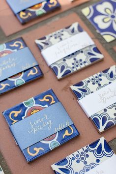 blue and white wedding stationery laid out on a table