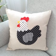 a pillow that has a chicken on it