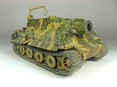 a toy army tank sitting on top of a white table