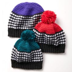 three knitted hats with pom - poms on them, one in multicolors