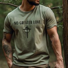 🔥This No Greater Love christian t-shirt is the perfect combination of style and comfort. This Cross graphic tee is the perfect shirt to show off your christian apparel or can be the perfect birthday gift, Easter gift or faith inspired gift.  🔥- Bella + Canvas 3001 Unisex T Shirt - Tear away label - Runs true to size 🔥Care Instructions Machine wash cold. Non chlorine bleach as needed. Tumble dry - low heat. Iron, steam or dry - medium heat. Do not dry clean. 🔥Production/Shipping 1-4 Business Days Production Time 2-5 Business Days Shipping Time 🔥Returns/Exchanges Since all of our items are custom printed once ordered, we do not accept returns or exchanges. Please look at our size chart to determine the best sizing for you.  🔥Our designs are printed using the highest quality professiona Men Christian Shirts Designs, Christian Shirts For Men, Mens Christian Shirts, Christian Gift Shop, No Greater Love, Christian Clothes, Cross Graphic, Jesus Clothes, Love Christian