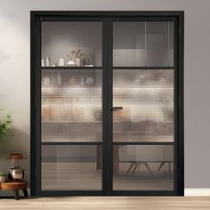 an empty room with two glass doors and a potted plant on the floor next to it