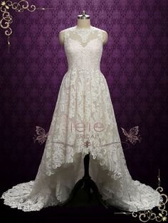 a white wedding dress on display in front of a purple background