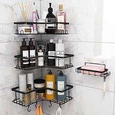 three tiered shelves in the corner of a bathroom with soaps, lotions and other items