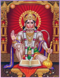 the hindu god sitting in front of an open book