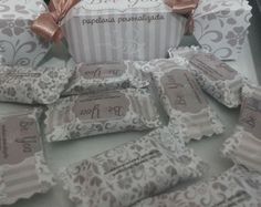 the wedding favors are wrapped in lace and ribbon