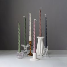 a group of candles sitting next to each other