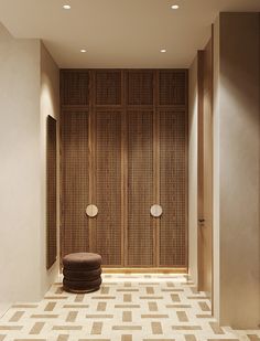 an empty room with two round stools in it