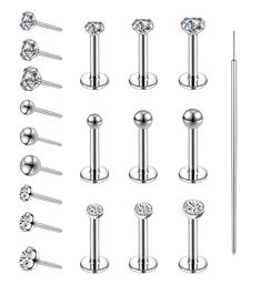 a set of different types of piercings with diamonds and pins on them, all in various shapes and sizes