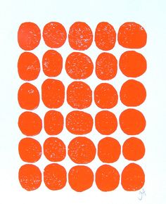 an orange piece of art that looks like circles