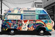 an old van is painted with colorful designs