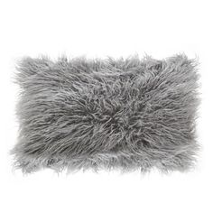 a gray furry pillow on a white background