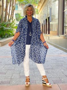 Printed Kari Kimono: Navy with White Anchors The one size Kari printed kimono completes any outfit or pairs beautifully with your favorite swimsuit! Details & Care: Cathy is 5'6 size small top and 8 jean One Size 100% viscose 37" L x 37" W Casual V-neck Rayon Kimono, Spring Short Sleeve Free Size Cover-up, Casual Rayon Kimono With V-neck, Casual Short Sleeve Summer Kimono, One Size Summer Kimono For Day Out, Summer One Size Kimono For Day Out, Casual Flowy Cover-up With Kimono Sleeves, Flowy Short Sleeve Kimono For Beach, Flowy Short Sleeve Beach Kimono