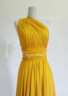 a yellow dress on a mannequin head