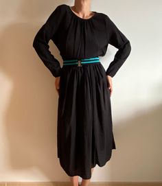 Vintage black dress, no labeled, in excellent condition. Fits best- S-M-L- depending on desired fit, shown on medium model, please look at the measures. Measurements: - Armpit to armpit, flat taken: 21,6 inch // 55 cm. - Sleeve: 23,6 inch // 60 cm. - Length: 49 inch // 125 cm. - Shoulders- 16,5 inch // 42 cm. Please note that all monitors depict color differently. All items come from a smoke free home. Please write me your phone number, Your number will be used only for delivery. Long Black Daywear Dress, Black Long Daywear Dresses, Oversized Black Midi Dress For Daywear, Black Flowy Midi Dress For Work, Flowy Black Maxi Dress With Long Sleeves, Black Flowy Long Sleeve Maxi Dress, Oversized Black Evening Dress, Vintage Black Dress, Phone Number