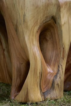 a close up of a wooden bench made out of wood