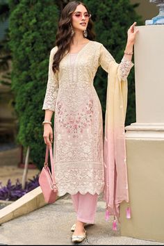 This exquisitely designed soft organza pant style suit Pakistani Suit is embellished with delicate resham, beads, sequins, and lace work, making it a standout piece for any occasion. From festive celebrations to social gatherings and cultural events, this pant suit showcases the ultimate combination of style and grace.     Fit:  Slim Fit (more fitted and snug at bust area)    Top: Soft Organza Silk  Bottom: Blended Silk  Dupatta: Embroidered Organza Silk   Resham thread work, beads, sequins, and Thread Work Suits Designs, Latest Suit Design 2024 For Women, Suit Lace Design, Suit Organza, Area Top, Celana Fashion, Suit Pakistani, Anarkali Dresses, Lace Suit