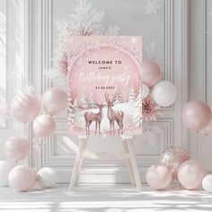 a welcome sign surrounded by pink and white balloons, snowflakes, and deer