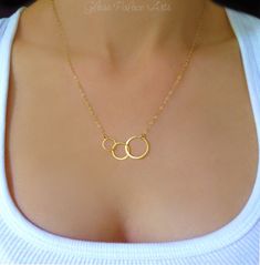 "* D E T A I L S * Three Circle Infinity Necklace * Sterling Silver, Gold or Rose Gold * Three circles are 14k gold vermeil or sterling silver (measuring about 32mm combined) * Chain is a shimmery 14k gold fill, rose gold fill or sterling silver chain * Total necklace length including circles shown at 19\" *choose your favorite length  * Necklace closes with a 14k gold fill, rose gold fill or sterling silver spring clasp * M O R E ∙ R E A S O N S ∙ T O ∙ L O V E ∙ I T * * Handmade by our small h Simple Infinity Jewelry For Anniversary, Circular Jewelry For Mother's Day, 14k Gold Circular Jewelry For Anniversary, Gold Infinity Jewelry For Anniversary, Delicate Circle Jewelry For Anniversary, Rose Gold Circle Jewelry For Anniversary, Simple Yellow Gold Jewelry For Anniversary, Delicate Circular Anniversary Jewelry, Infinity Jewelry With Simple Design For Gift