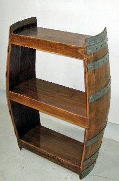 a wooden shelf with two metal barrels on the bottom and one is made out of wood