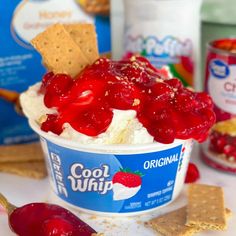 an ice cream sundae with cherries and crackers