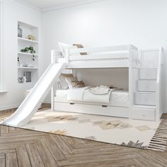 a white bunk bed with a slide in the middle