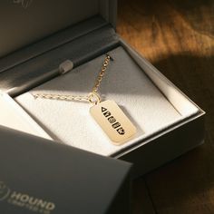 A special gift for a dog dad. Made from approx. 25 grams of solid 18K gold, our personalised pendants are a testament to the unbreakable bond between man and his best friend.  Inspired by the adventures we share, the hard times we endure, and the everyday moments we cherish while they're here. And fondly remember when they're not. A unique symbol of connection: - A triangle, the strongest shape, represents the strength of the bond. - A paw-in-hand marks the trust & loyalty they share. - And a compass signifies their guidance. The final two symbols are custom engraved, making the piece unique to the owner and their dog. - The year they came into the owner's life. Because from that moment on, their lives changed forever. -And finally, their dog's initial. (Please take care entering this info Unique Symbols, Memorial Pendant, Personalized Pet Memorial, 18k Gold Chain, Pet Memorial Gifts, Personalised Gifts For Him, Personalized Pendant, 18k Gold Jewelry, Everyday Moments