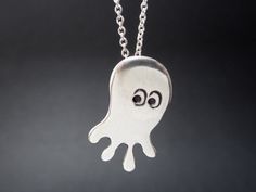 I call this guy the Quadrapus! Super cute octopus charm necklace. This will bring a smile to your face each time you wear him. Made from solid sterling silver and ships from my Oakland California workshop. For the smaller version: http://www.etsy.com/listing/62800802/little-quadrapus-necklace For the earrings: http://www.etsy.com/listing/62800831/quadrapus-earrings Mother-Daughter Set: http://www.etsy.com/listing/67919329/mother-daughter-quadrapus-necklace-set Items are shipped without a receipt Fun Sterling Silver Jewelry In Silver, Fun Sterling Silver Jewelry In Silver Color, Silver Fun Necklace For Gift, Fun Silver Necklace For Gift, Octopus Necklace, Cute Octopus, Cute Packaging, Chain Ring, Octopus