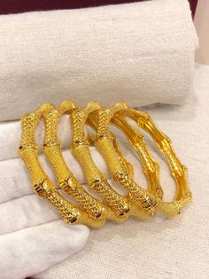 Christmas Gift, Holiday Gift,  24k gold plated Bangles, Indian Bridal Bangles, Handmade Bracelet for Women Gold Bangles for Women - Indian Bridal Bangles - Handmade Bracelet These stylish bangles feature a classic bangle design and are available in gold color. ▶ BEAUTIFUL HINGED GOLD BRACELET ▶ HIGED TO OPEN WIDE----- STAYS SECURELY SHUT ----- LIFT TAB SIDE TO OPEN Material: High quality 24k gold plated bangles ( Not solid gold) Diameter: 2.36 inches Can open Lead & Nickel free Tarnish resistant Gold Bangle With Intricate Design For Puja, Traditional Gold Bracelet With Hand Set Details, Gold Temple Jewelry Bracelets For Puja, Gold-plated Gold Bracelets For Puja, Gold Plated Bangle Bracelet For Puja, Gold-plated Bracelets For Diwali, Gold Plated Bracelets For Diwali, Gold Plated Bracelets For Puja And Festivals, Gold Bracelets For Diwali Festival