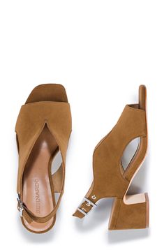 Curvy cutouts and a deep vamp distinguish this leather slingback pump set on a cushioned footbed and lofty block heel. 2" heel Cushioned footbed Leather upper, lining and sole Made in Brazil Brown Slingback Pumps With Block Heel For Work, Chic Slingback Pumps With Wooden Block Heel, Chic Slingback Sandals With Wooden Block Heel, Modern Leather Low Heel Slingback Sandals, Leather Slingback Sandals With Low Heel, Modern Leather Slingback Sandals With Low Heel, Chic Brown Slingback Pumps With Block Heel, Stacked Block Heels With Open Heel For Work, Suede Slingback Sandals With Open Heel