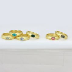 Thick band with oval stone in center Modern Gold Ring With Large Stone, Modern Gold Rings With Large Stone, Gold Ring With Large Oval Cabochon Stone, Gold Oval Ring With Large Stone, Modern Gold Signet Ring With Birthstone, Gold Promise Ring With Large Stone, Gold Oval Dome Ring With Gemstone, Modern Gold Birthstone Ring With Gemstone, Modern Gold Gemstone Birthstone Ring