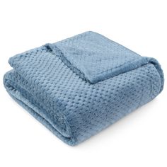 a blue blanket folded on top of each other