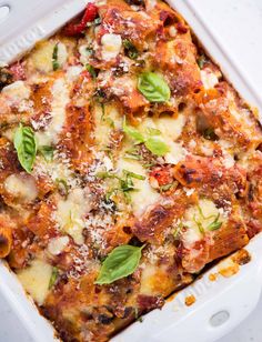 a casserole dish with meat, cheese and vegetables