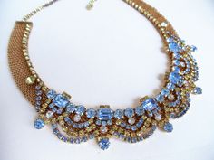 "Hattie Carnegie Necklace, Vintage Mid Century Blue Aurora Borealis Rhinestone Mesh Choker Necklace, Blue & Gold Tone Bridal Jewelry, Wedding, 1940s' Gorgeous by Hattie Carnegie rare mid century estate necklace featuring rich vibrant gold metal Mesh choker necklace decorated with baby blue iridescent Aurora Borealis Rhinestones. Magnificent Hattie Carnegie design complemented by beautiful, reflecting the light, sparkling blue, clear, and champaign color rhinestones make this necklace stand o Elegant Blue Necklace For Receptions, Elegant Blue Necklace For Reception, Blue Crystal Jewelry For Celebration, Formal Blue Bridal Necklace With 17 Jewels, Blue Jeweled Rhinestone Costume Necklace, Blue Sparkling Stone Necklaces For Wedding, Sapphire Jeweled Necklace For Wedding, Blue Necklaces With Sparkling Stones For Wedding, Blue Sparkling Stones Necklace For Wedding