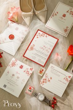 the wedding stationery is laid out and ready to be put into the bride's shoes