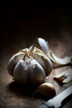 an image of garlic being peeled on the table