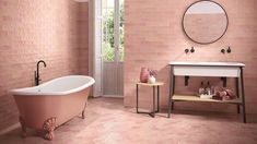 a bathroom with pink walls and floor tiles