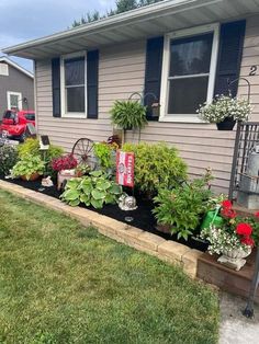 a house that has some plants in front of it