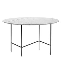 a white marble table with black metal legs and an oval shaped dining room table top