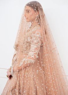 Pakistani Gown and Bridal Lehenga with Heavy Embroidery Dress is a breathtaking attire adorned with Embroidery work, Floral designs, Crystals, and Sequins. Embellished Gown For Wedding Eid Festival, Embellished Gown For Wedding And Eid, Embellished Anarkali Dress For Ceremony, Anarkali Style Embellished Wedding Dress For Eid, Semi-stitched Intricate Embroidered Wedding Dress For Eid, Semi-stitched Wedding Dress With Intricate Embroidery For Eid, Embroidered Wedding Dress For Eid, Eid Wedding Dress With Zari Work For Ceremony, Ceremony Gown With Saree Shape And Intricate Embroidery