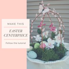 an easter centerpiece with flowers and eggs