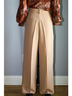 FEATURES Elegant, Classy & Chic High Waisted Wide Leg Pants The wide-leg trouser is a flattering and chic silhouette designed to flatter your shape. Adding a front pleat and pockets, these trousers have a relaxed but tailored construction. Button/zip fly closure with front button, zipper fly, and belt loops. FABRIC 78% Polyester, 18% Rayon, and 4% Spandex Imported SIZE + FIT Sizing is True to Size | Tapered Fit with minimal stretch Size Bust Waist Hip Small (2-4) 36” - 37” 27” – 28” 36” – 37 Tailored Solid Color Wide Leg Full Length Pants, Tailored Full Length Wide Leg Pants, Tailored Full Length Solid Wide Leg Pants, Loosely Fitted Full Length Solid Dress Pants, Elegant Beige Stretch Bottoms, Semi-formal Stretch Bottoms For Spring, Elegant Stretch Beige Bottoms, Spring Semi-formal Stretch Bottoms, Fitted Full-length Leather Pants