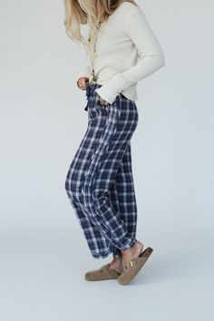 Introducing the Prairie Plaid Pants - the perfect pants for adding a touch of bohemian style to your wardrobe without sacrificing the comfort! Comfortable, mineral washed fabric with plaid pattern detailing Relaxed and loose wide leg silhouette Classic elastic waistband with adjustable ribbon for flattering fit Convenient side pockets (we love pockets!) Curved hem for added style and movement Pair with: High Neck Racerback Brami, Cozy Cabin Turtleneck Poncho and Gizelle Necklace. *Due to lightin Plaid Cotton Bottoms With Elastic Waistband, Fall Harem Pants For Loungewear, Straight Leg, Fall Straight Leg Harem Pants For Loungewear, Relaxed Fit Cotton Plaid Pants, Relaxed Fit Plaid Pants With Elastic Waistband, Spring Plaid Loungewear Pants, Fall Linen Loungewear Bottoms, Plaid Bottoms With Pockets For Loungewear, Plaid Bottoms With Elastic Waistband For Loungewear