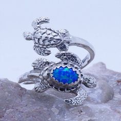 Sea Turtles adjustable spoon ring for LadiesMaterial: Sterling Silver 925Size Adjustable size 7 to 9Stamped "925"Gemstone: 5X7mm blue opal (or see selection for other choices)Beautiful creatures from the Oceans!ring for womenComes with jewelry boxready to ship Adjustable Nickel-free Opal Jewelry, Adjustable Silver Opal Promise Ring, Adjustable Nickel-free Opal Ring As A Gift, Adjustable Silver Opal Toe Ring, Adjustable Blue Opal Ring, Adjustable Opal Rings For Gifts, Adjustable Opal Ring Jewelry, Adjustable Opal Rings Gift, Adjustable Open Opal Ring With Gemstone