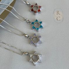 Discover the elegance of this silver Magen David necklace adorned with colored stones. A symbol of protection and spirituality, this exquisite Star of David pendant will captivate all eyes. From purple, crystal clear to deep orange, this pendant accurately represents the Star of David. You will love wearing it with a fresh outfit for any occasion. Lastly, it makes a perfect gift to give or indulge yourself. ADDITIONAL DETAILS D E T A I L S: * MATERIAL: 925 Sterling Silver * PENDANT SIZE: 15mm x Silver Star Of David Birthstone Jewelry, Silver Star Of David Jewelry With Birthstone, Silver Star Of David Necklace With Gemstone, White Gold Star Of David Spiritual Jewelry, Spiritual White Gold Star Of David Jewelry, Spiritual Star Of David White Gold Jewelry, Silver Star Of David Necklace For Hanukkah, Hanukkah Sterling Silver Silver Necklace, Silver Sterling Silver Necklace For Hanukkah