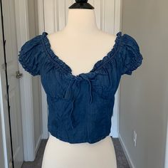 Nwt Never Worn!! It Is Tagged A Large But It Fits More Like A S/M. So I Labeled It As Such. Would Fit A B Cup Or C Cup. Denim Blue Cotton Puff Sleeve Tops, Blue Ruffled Cotton Denim Top, Puffed Sleeves Blouse, Chambray Denim Button-up Top, Washed Blue Chambray Button-up Denim Top, Dark Wash Chambray Button-up Denim Top, Red Button Down Shirt, Eyelet Shirt, Checked Jacket