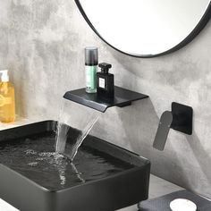 a bathroom sink with a faucet and soap dispenser